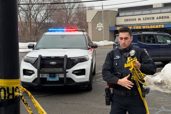 Police continue to tape off the Dennis M. Lynch arena a day after a deadly shooting during a youth hockey game on Tuesday, Feb. 17, 2026 in Pawtucket, R.I. (AP Photo/Rodrique Ngowi)