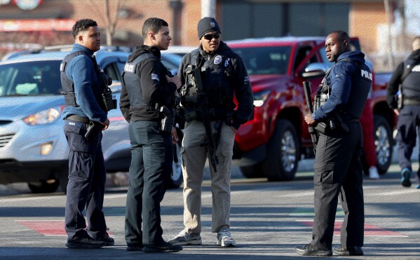Police congregate near the Lynch Arena in Pawtucket, R.I., after a shooting occurred at the ice rink, Monday, Feb. 16, 2026. (AP Photo/Mark Stockwell)