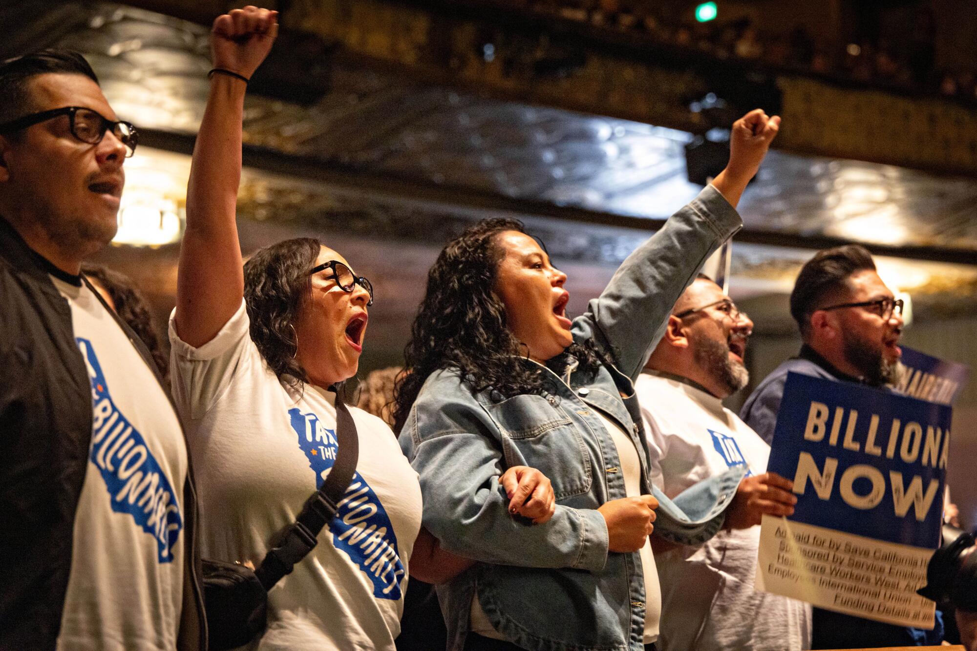 Supporters attend the Billionaire Tax Now rally at The Wiltern in Los Angeles.