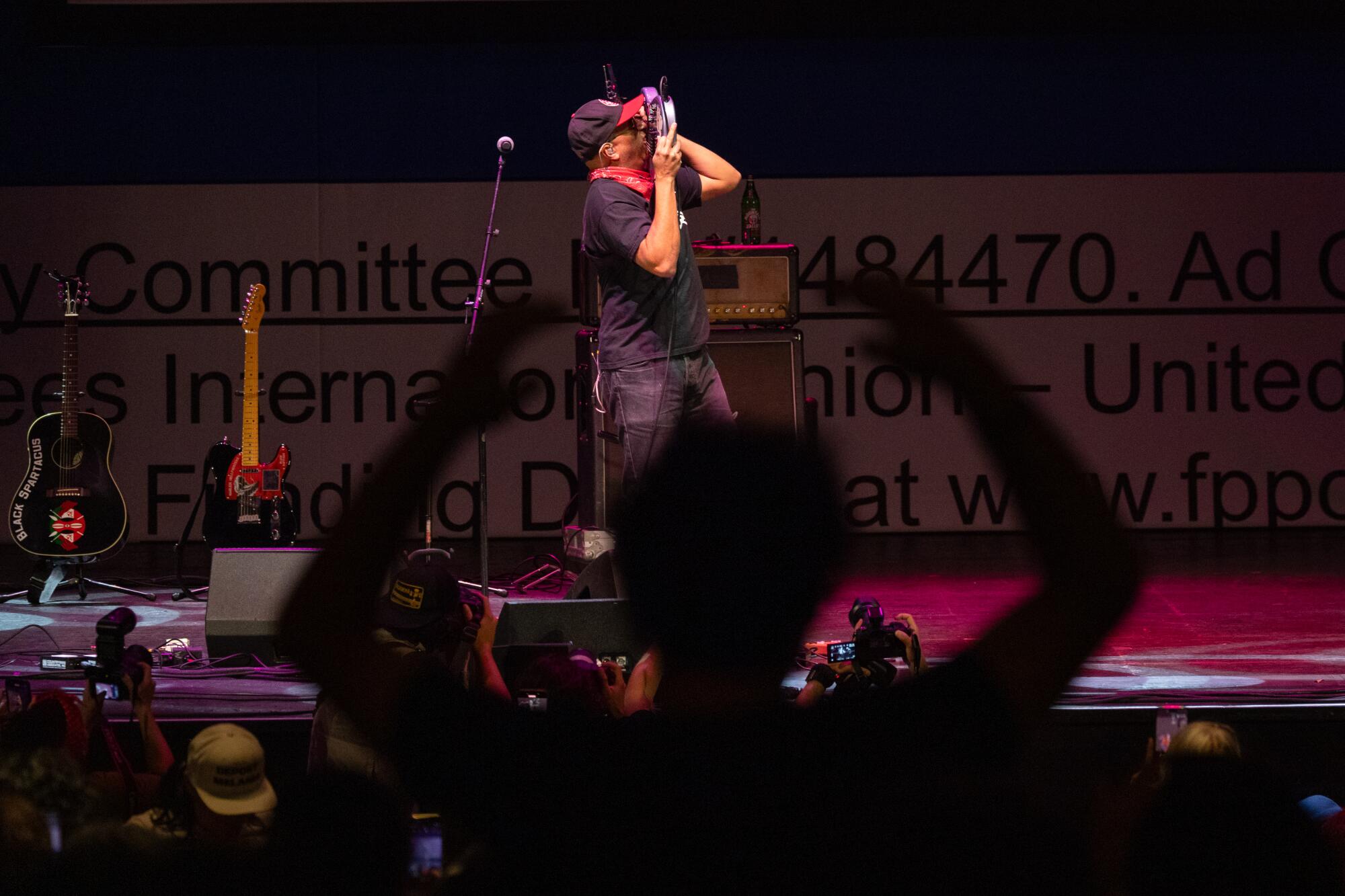 Tom Morello performs at the Billionaire Tax Now rally at The Wiltern in Los Angeles.