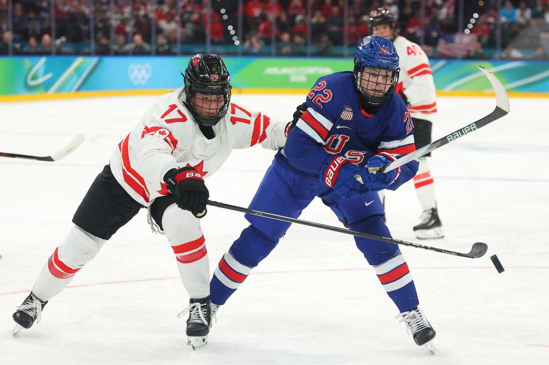 Ella Shelton of Canada (L) and Tessa Janecke (R) the United States skate after the puck in the second period during the Women's Gold Medal at the 2026 Winter Olympics on Thursday in Milan, Italy.