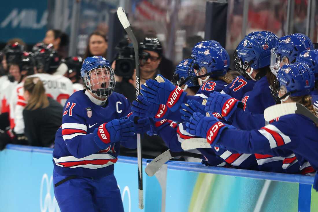 Hilary Knight #21 of the United States celebrates with teammates after scoring a goal late in the third period to even the score 1-1 during the women's gold medal match between the U.S. and Canada at the 2026 Winter Olympics on Thursday.