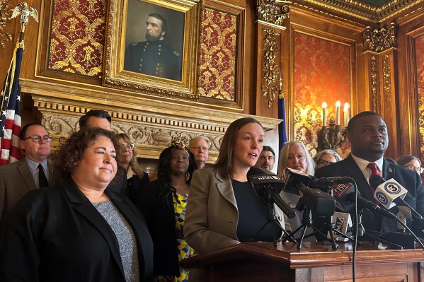 Democratic Wisconsin Assembly Minority Leader Greta Neubauer, surrounded by Democratic colleagues, speaks in support of measures to expand Medicaid coverage for new mothers and insurance coverage for breast exams at a news conference in the state Capitol on Wednesday, Feb. 18, 2026, in Madison, Wis. (AP Photo/Scott Bauer)