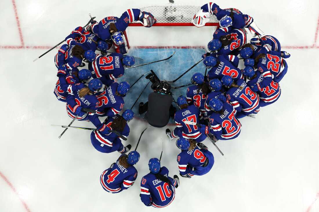 The U.S. women's ice hockey team huddles prior to a match against Czechia on Feb. 5, 2026 in Milan.