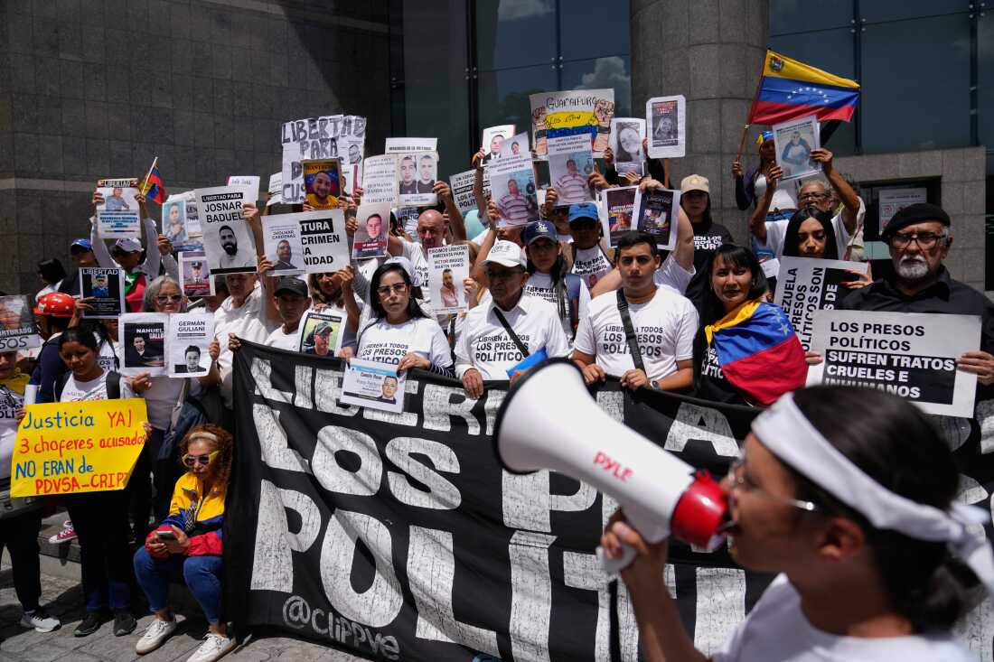 People who consider their detained family members to be political prisoners call for their releases outside the United Nations office in Caracas, Venezuela, Wednesday Feb. 18, 2026.