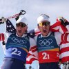 Gus Schumacher, left, and Ben Ogden, of the United States, celebrating a historic win for Team USA in Tesero, Italy, today.