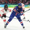 Ella Shelton of Canada (L) and Tessa Janecke (R) the United States skate after the puck in the second period during the Women's Gold Medal at the 2026 Winter Olympics on Thursday in Milan, Italy.
