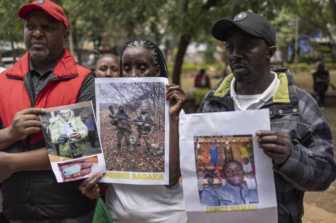 Relatives of Kenyan nationals conscripted by the Russian army in Ukraine pose with photos of their family members during a demonstration demanding urgent government action to repatriate their kin, in Nairobi on Feb.19, 2026.