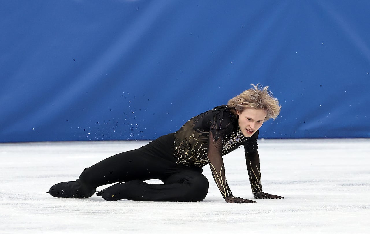 A skater falls on the ice.