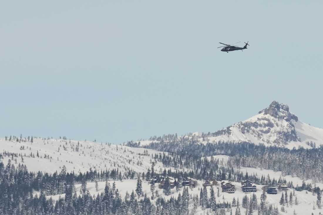 A U.S. Army Blackhawk helicopter flies toward the Castle Peak area of Northern California in recovery search for skiers on Saturday, after one of the deadliest avalanches in state history.