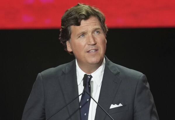 FILE - Tucker Carlson speaks at a memorial for Charlie Kirk on Sept. 21, 2025, at State Farm Stadium in Glendale, Ariz. (AP Photo/Ross D. Franklin)