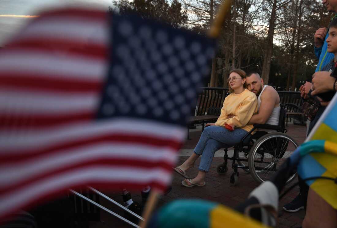 Sgt. Misha Varvarych, a Ukrainian war amputee, and his fiancé Ira Botvynska take a stroll at Lake Eola Park