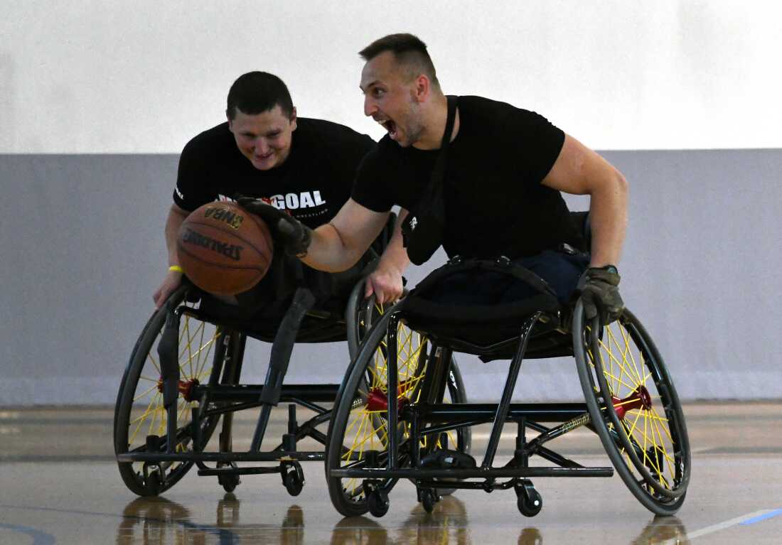 Sgt. Misha Varvarych, a Ukrainian war amputee plays wheelchair basketball with fellow soldier Andrii Nasada during a stay at Lakeshore, an Olympic & Paralympic Training Site in Birmingham Alabama