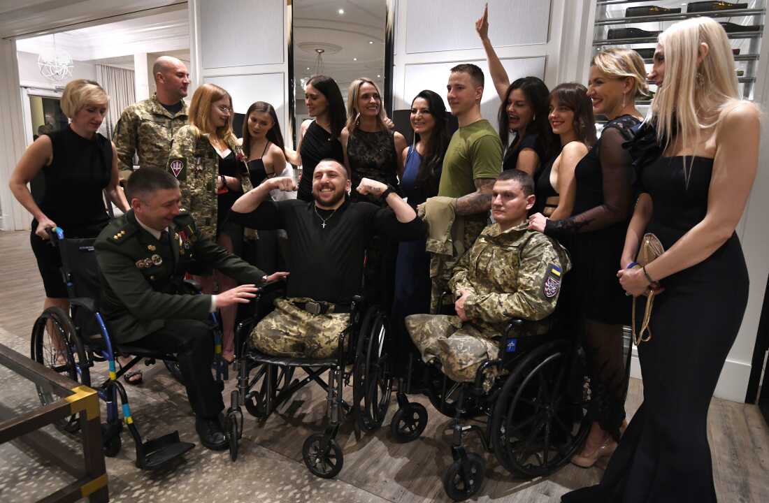Sgt. Misha Varvarych, a Ukrainian 80th Airborne Assault Brigade commander attends a fundraiser gala in full uniform for Revived Soldiers Ukraine
