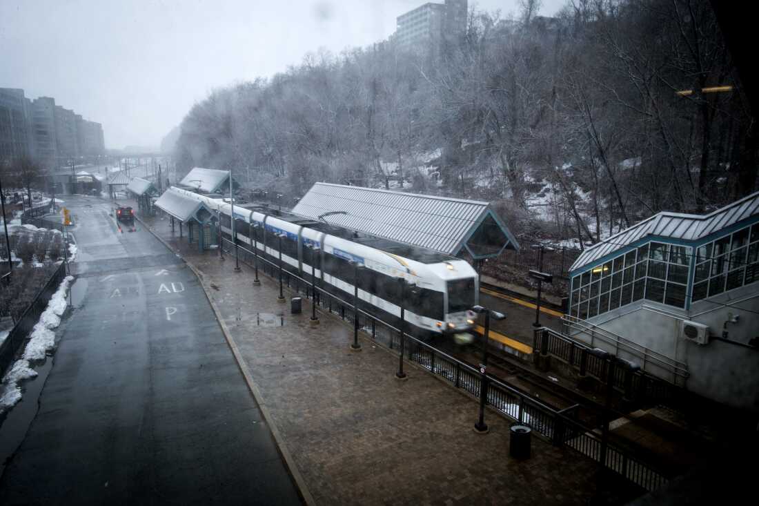 New Jersey Light Rail arrives at Port Imperial Station as snow falls on Sunday in Weehawken, N.J.