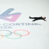 Figure skater Li Yu-Hsiang lies on his back on the ice.