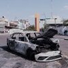 A vehicle sits charred after being set on fire, on a road in Guadalajara, Jalisco state, Mexico, Sunday, Feb. 22, 2026, after the death of the leader of the Jalisco New Generation Cartel, Nemesio Rubén Oseguera Cervantes, known as"El Mencho."