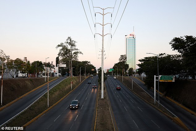 Vehicles on an almost empty street a day after a series of blockades and attacks by organized crime following a military operation in which cartel boss Nemesio Oseguera, "El Mencho," was killed, in downtown Guadalajara, Mexico, February 23, 2026. REUTERS/Michelle Freyria