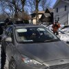 Federal immigration agents confront observers monitoring their activity from inside their cars while patrolling a neighborhood in Minneapolis on Jan. 29.