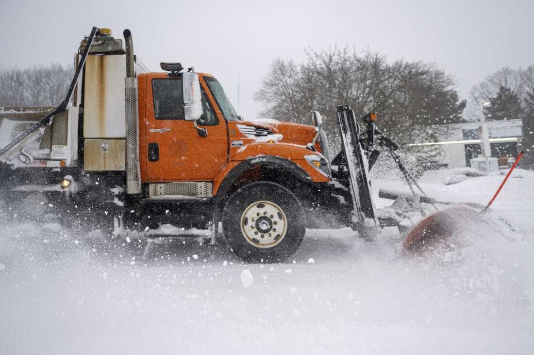 A plow clears Silver Lane between East Hartford and Manchester on Feb. 23.