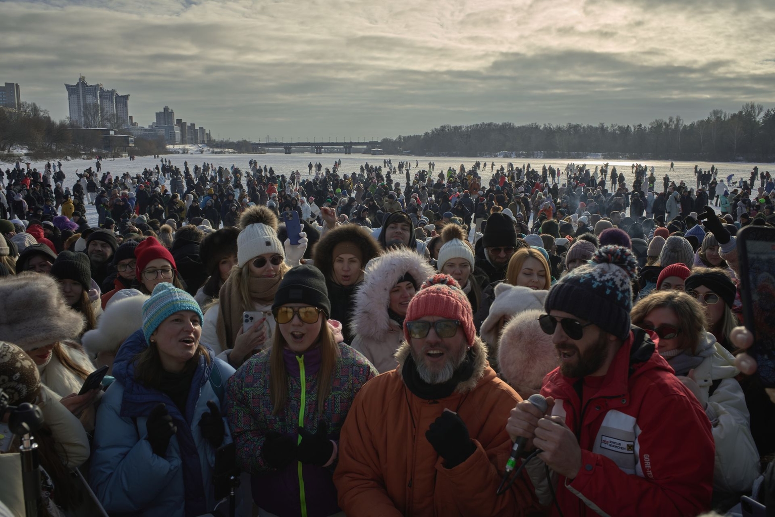 People gather for an improvised outdoor party on the frozen Dnipro River on Rusanivska Spit in Kyiv, Ukraine, on Jan. 31, 2026.