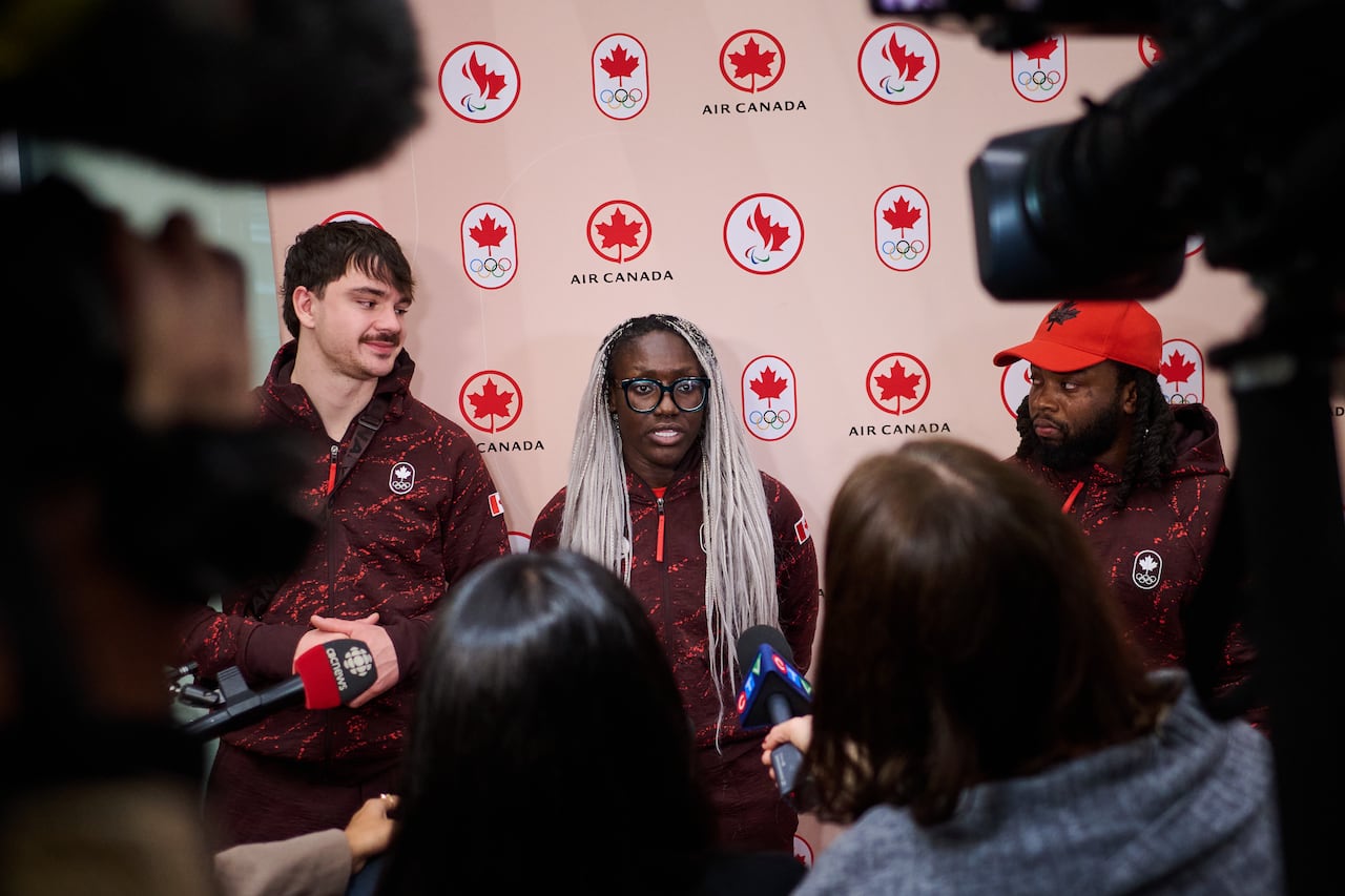Canadian bobsleigh athletes speak to the media.