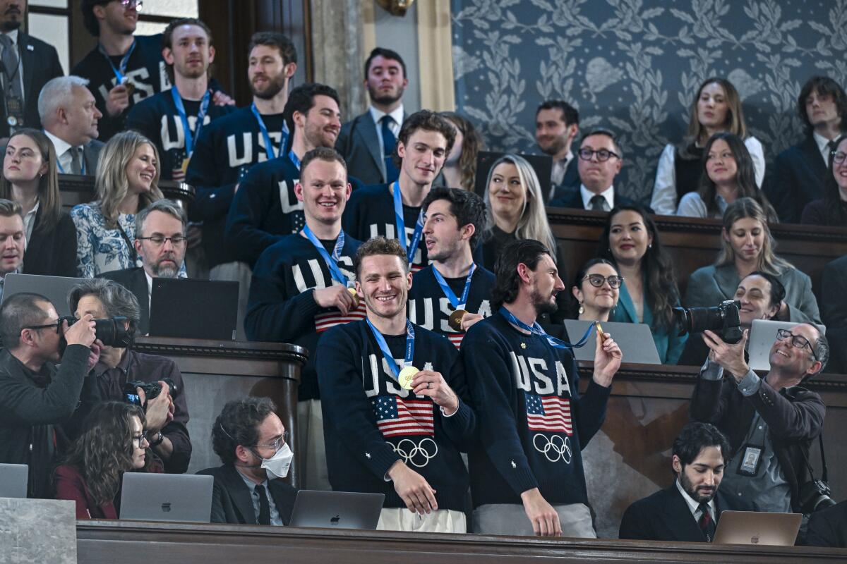 The U.S. Olympic men's ice hockey team arrives for the State of the Union address .