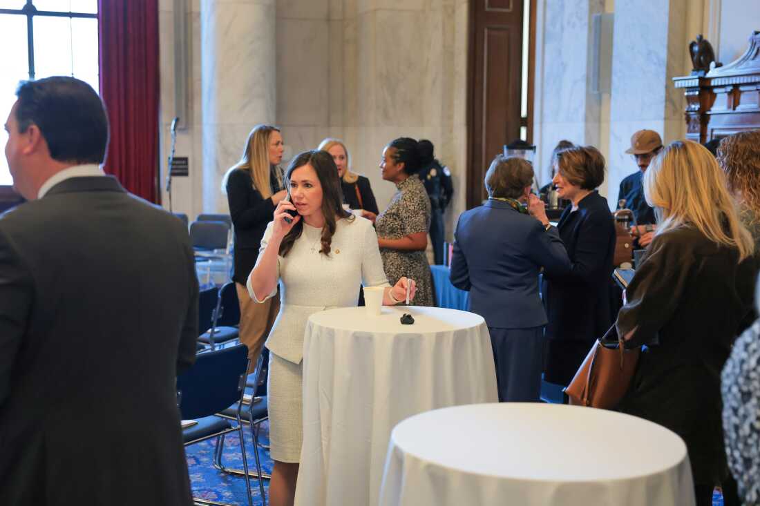 Britt speaks on the phone at the National Prayer Breakfast in the Kennedy Caucus Room on Capitol Hill on Feb. 05. Britt says her constituents sent her to Washington to find compromise. "Anybody can go sit in a corner," she says.