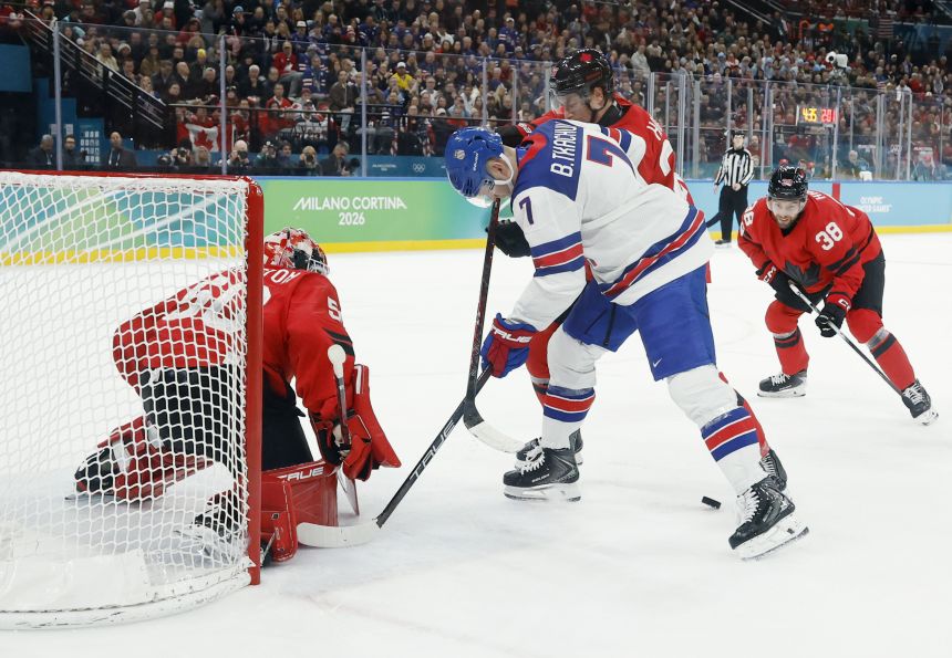 Jordan Binnington of Canada makes a save against Brady Tkachuk of the United States in the men's ice hockey gold medal game during the Milano Cortina 2026 Olympic Winter Games in Milan, on February 22, 2026.