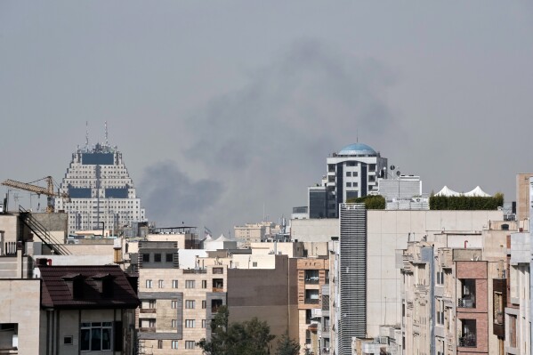 Smoke rises on the skyline after an explosion in Tehran, Iran, Saturday, Feb. 28, 2026.(AP Photo/Vahid Salemi)