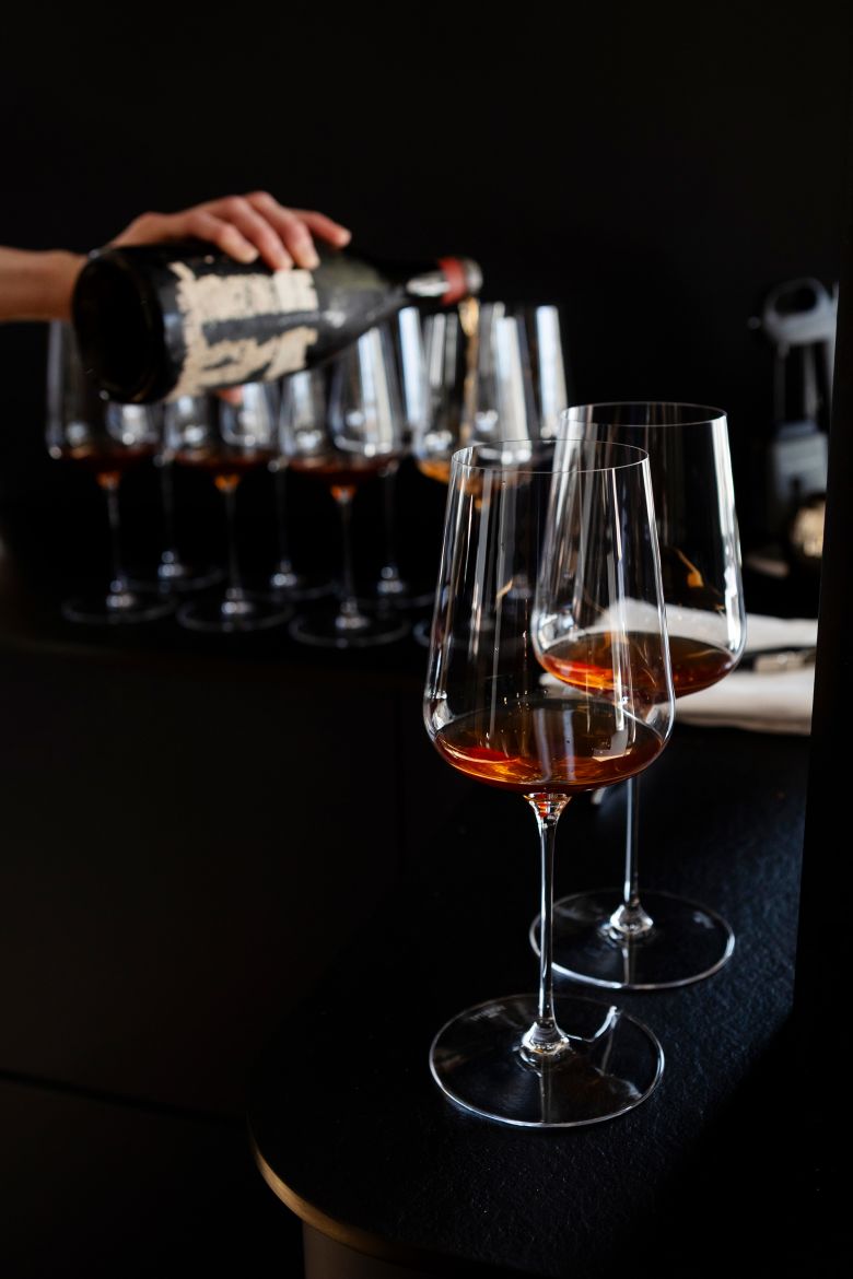 Serving of the 1899 Romanée-Conti bottle.