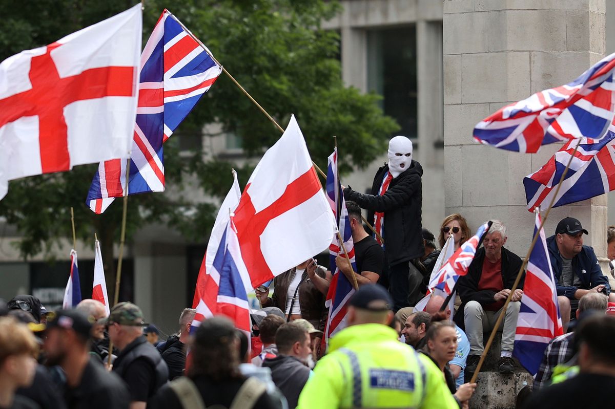 A person in a white balaclava takes part in the Britain First March For Remigration on August 2, 2025 in Manchester, England. 