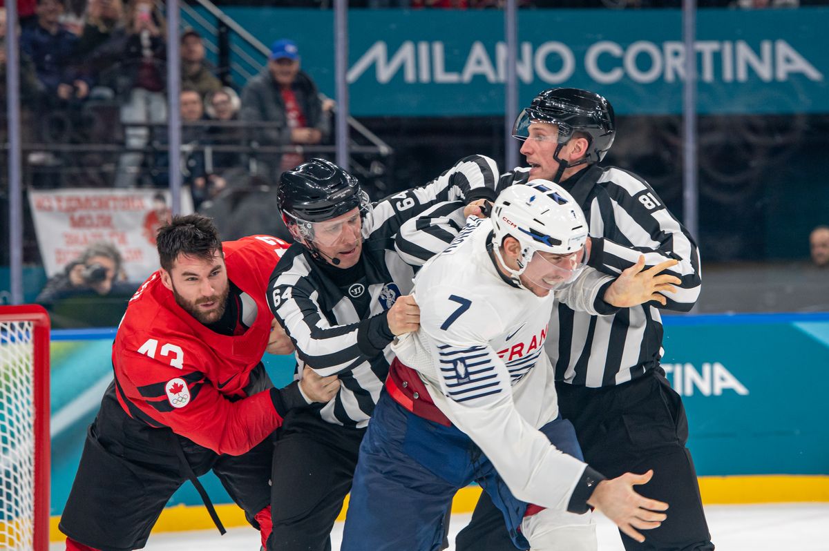 Pierre Crinon skates away after fighting with Tom Wilson during a 10-2 win for Canada over France