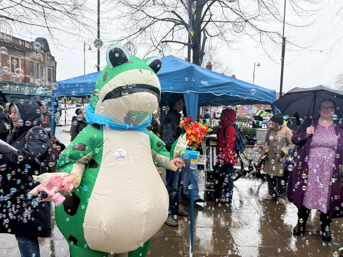 Hundreds gathered in Moseley this afternoon as British flags were taken down from lampposts 