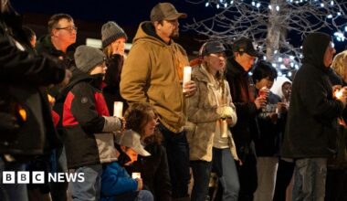 Community members mourn during a candlelight vigil for the victims of Tumbler Ridge Secondary School in Canada