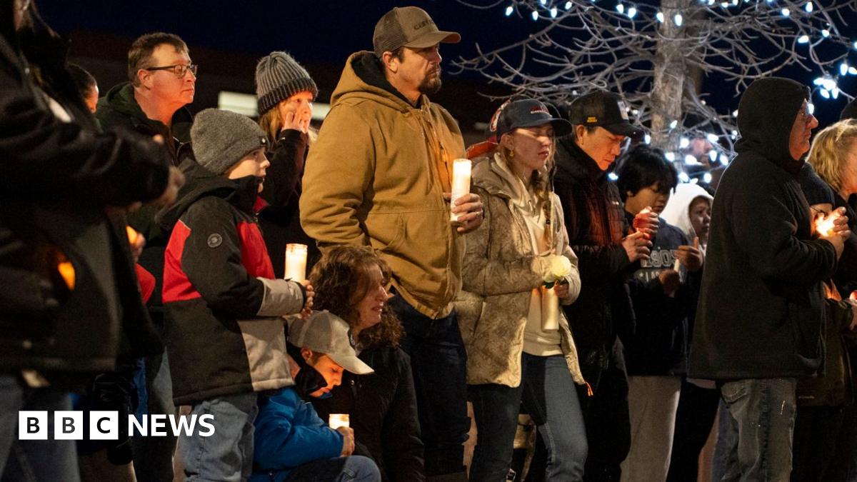 Community members mourn during a candlelight vigil for the victims of Tumbler Ridge Secondary School in Canada