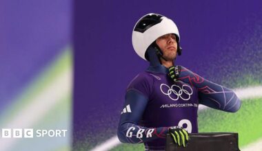 Matt Weston does up his race suit