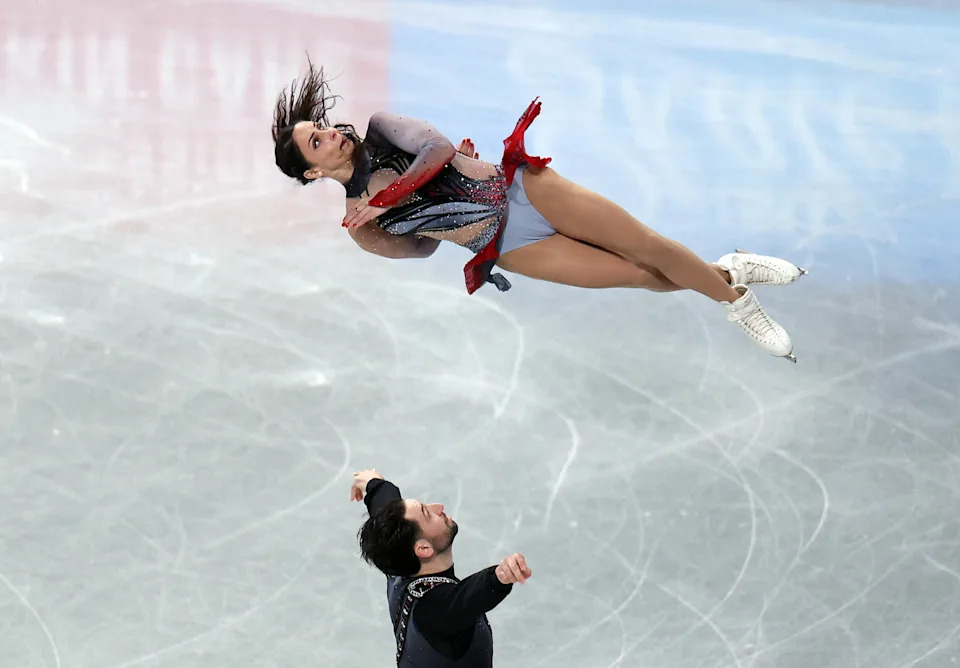 Figure Skating - ISU Grand Prix of Figure Skating - Grand Prix Final - Aichi International Arena, Nagoya, Japan - December 4, 2025 Canada's Deanna Stellato-Dudek and Maxime Deschamps perform during the pairs short program REUTERS/Issei Kato