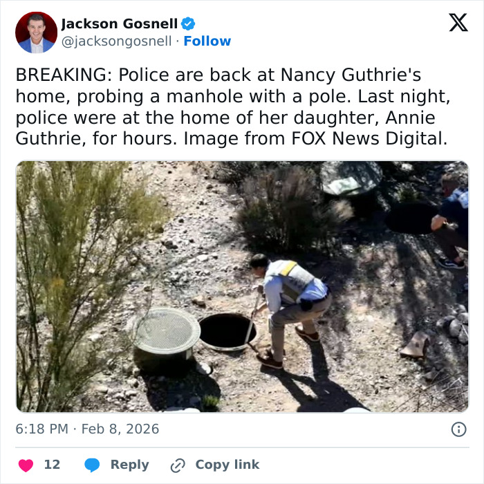 Police officer probes manhole near Nancy Guthrie's home during investigation into her disappearance in a dry, scrubland area. Police officer probes manhole near Nancy Guthrie's home during investigation into her disappearance in a dry, scrubland area.
