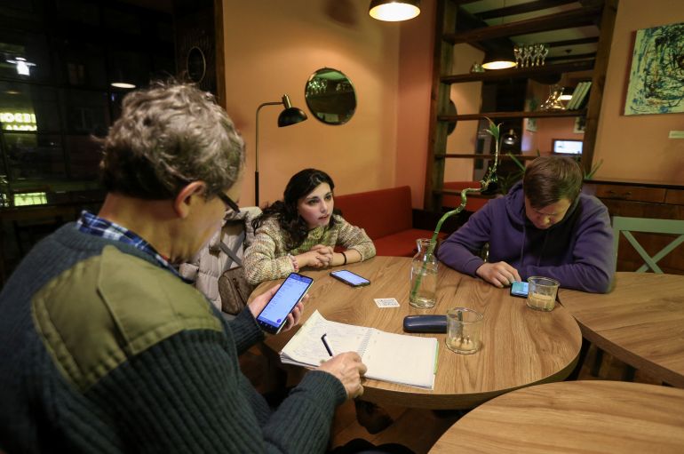 Georgian citizen and teacher Miriam Nozadze conducts a Georgian language lesson for Russian exiles in Tbilisi, Georgia, February 15, 2023. REUTERS/Irakli Gedenidze