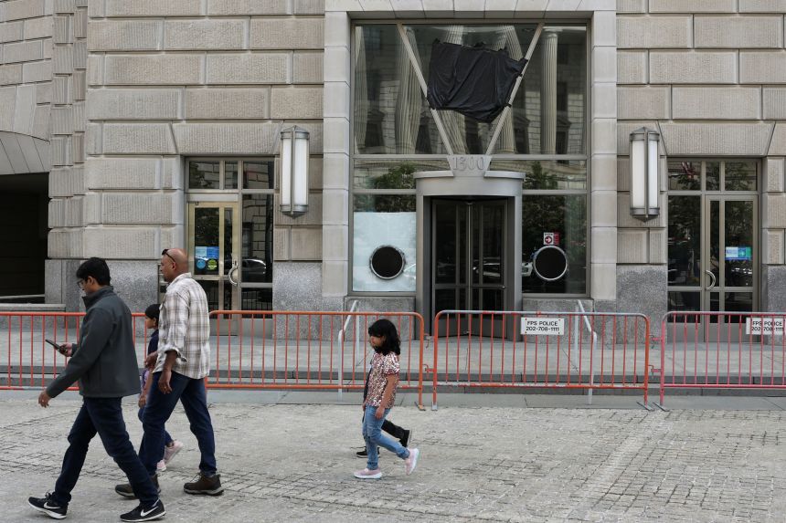 A black plastic shroud covers the signage of the former offices of the US Agency for International Development (USAID) in Washington D.C., on April 24, 2025.