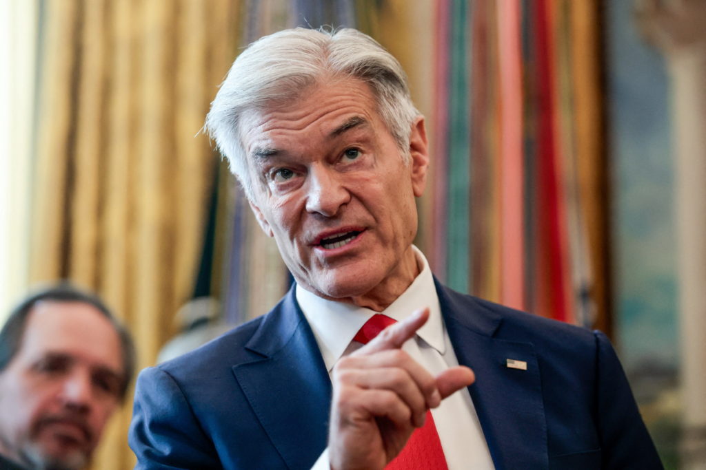 U.S. President Trump signs executive orders at the Oval Office, in Washington