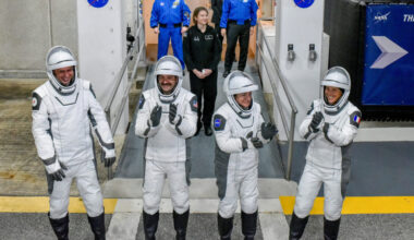NASA's SpaceX Crew-12 crew members walk out of the Operations & Checkout Building at the Kennedy Space Center before t...