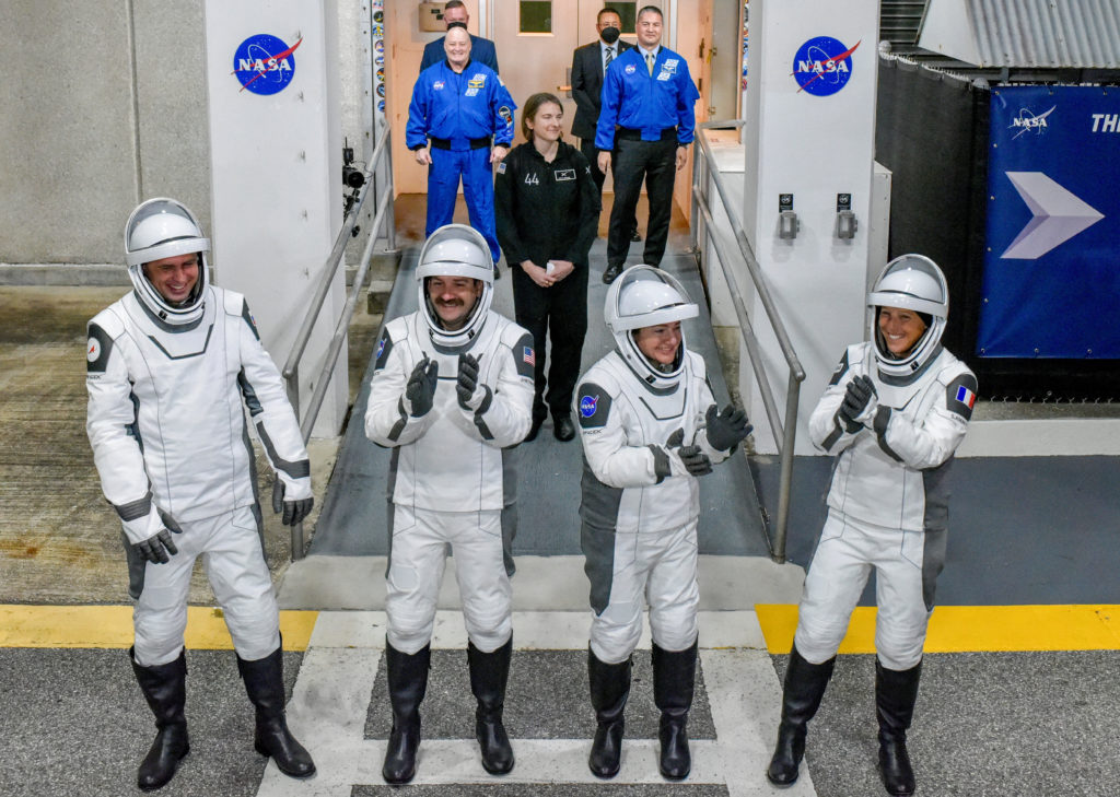 NASA's SpaceX Crew-12 crew members walk out of the Operations & Checkout Building at the Kennedy Space Center before t...
