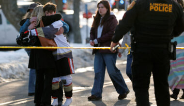 Police and emergency vehicles are seen outside the Dennis M Lynch Arena, an indoor ice skating rink, after a shooting in P...