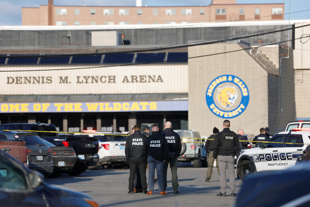Police and emergency vehicles are seen outside the Dennis M Lynch Arena, an indoor ice skating rink, after a shooting in P...