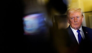 U.S. President Donald Trump speaks to reporters onboard Air Force One