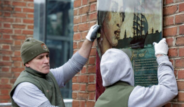 Workers from the National Park Service reinstall a slavery exhibit at a historic site in Philadelphia
