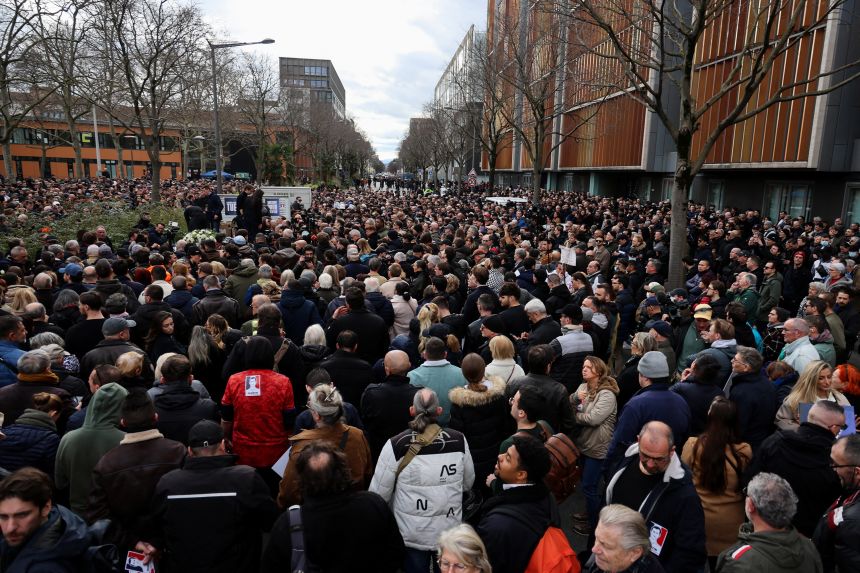 People gather Saturday for a march in tribute to Quentin Deranque, a young far-right activist beaten to death during a violent assault by hard-left activists, in Lyon, France.