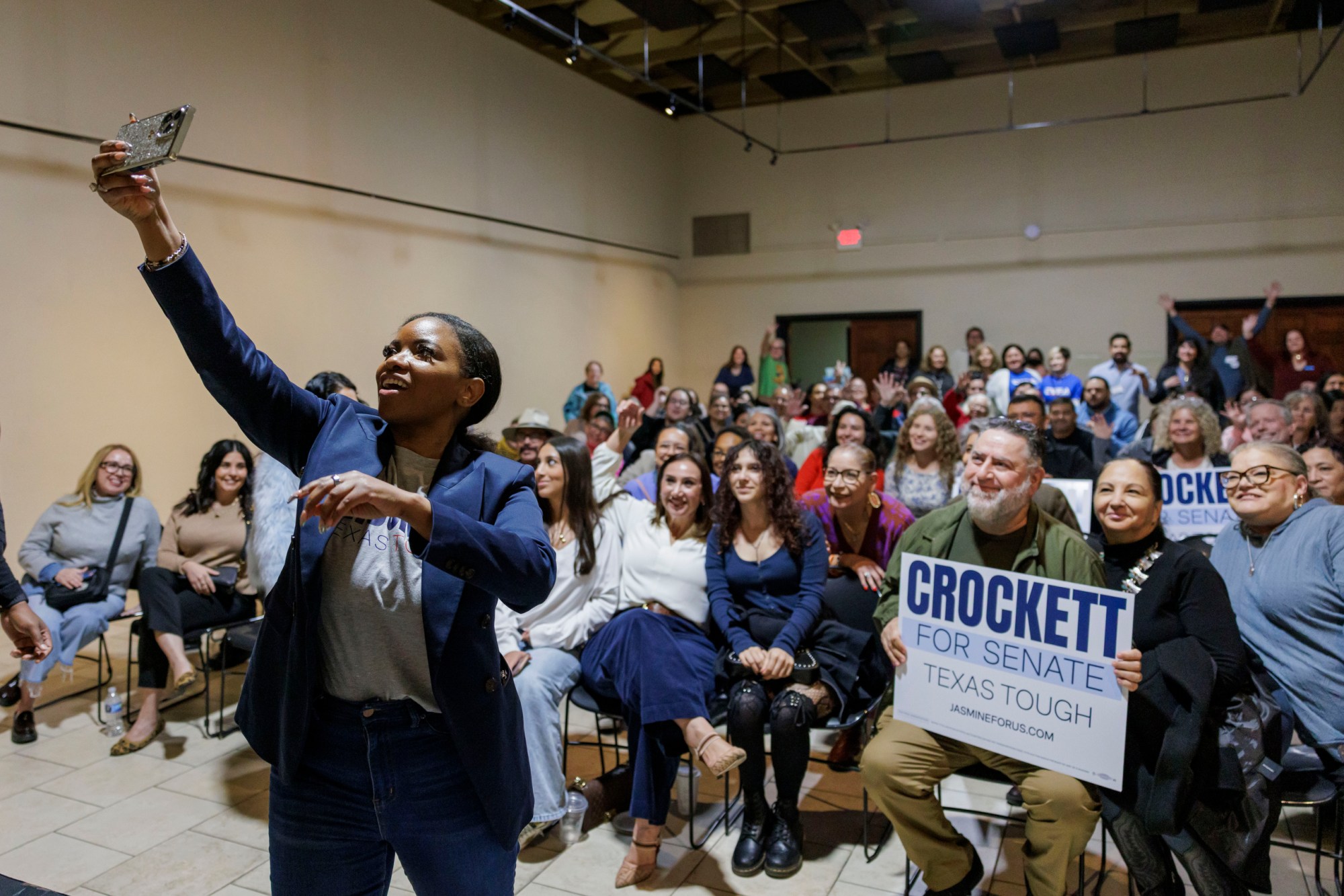 U.S. Rep. Jasmine Crockett takes a selfie with attendees at a campaign event for her Democratic primary bid for the U.S. Senate in Brownsville on Jan. 10, 2026.